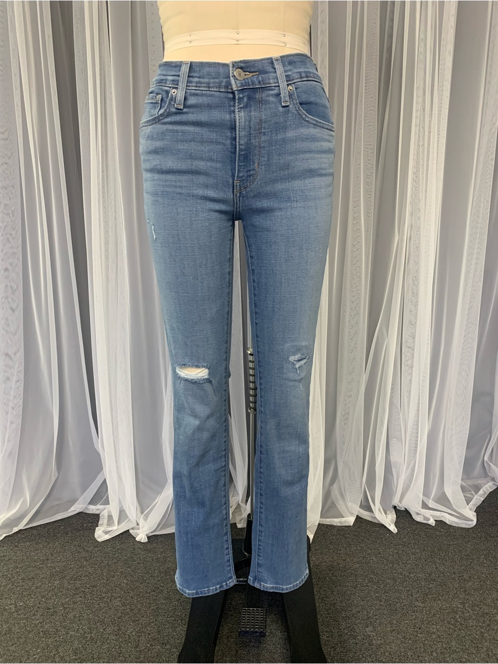 Levi's 724 Light Blue Straight-Leg Jeans with Knee Distress